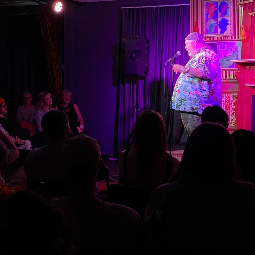 Comedy show by a man in the colourful T-shirt in The Rubber Chicken comedy pub