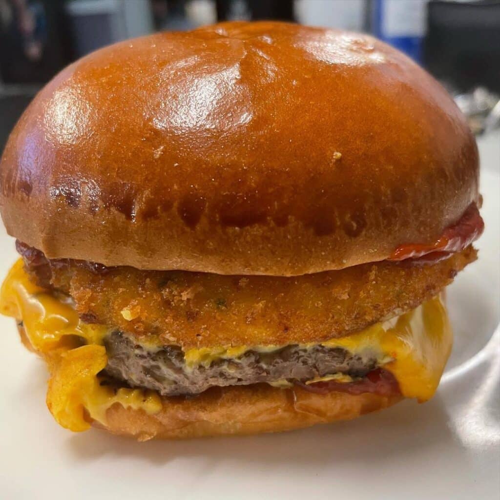The Colossus with hash brown, cheese, and beef