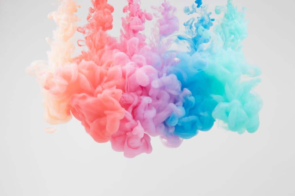 Colourful smoke illustration, and the colours from left to right is yellow, red, pink, purple, blue, green