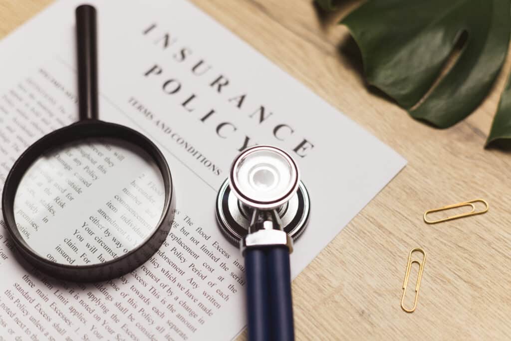 Doctor's stethoscope, medical record and health insurance document. Concept of healthcare