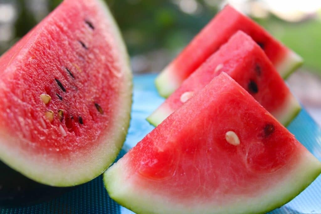 sliced watermelon on a blue plate.